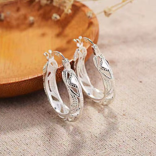 Elegant Hollow Carved Silver Hoop Earrings